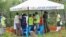 Forensic experts and homicide detectives from the Directorate of Criminal Investigations (DCI), gather to exhume bodies of suspected followers of a Christian cult named as 'Good News International Church', in Shakahola forest, Kenya, May 9, 2023.