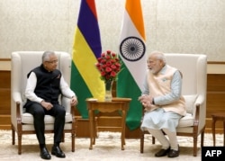 FILE - India's Prime Minister Narendra Modi, right, and his Mauritius counterpart Pravind Jugnauth speak during a bilateral meeting in New Delhi, Sept. 8, 2023.