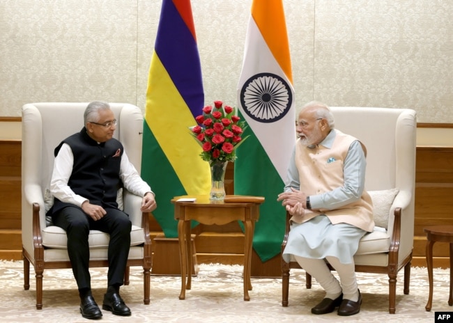 FILE - India's Prime Minister Narendra Modi, right, and his Mauritius counterpart Pravind Jugnauth speak during a bilateral meeting in New Delhi, Sept. 8, 2023.