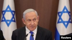 Israeli Prime Minister Benjamin Netanyahu attends the weekly cabinet meeting in the prime minister's office Jerusalem, Feb. 19, 2023. Netanyahu said that Iran was responsible for a reported attack on an oil tanker last week. 
