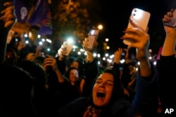 Women shout slogans as they gather to mark International Women's Day in Istanbul, Turkey, March 8, 2023.