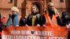 Activists of the environmental group "Last Generation" (Letzte Generation) line up for a march outside the Saint Thomas Church in Berlin's Kreuzberg district, Germany, Apr. 26, 2023.