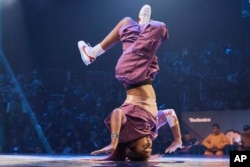 FILE - Logan Edra, also known as B-Girl Logistx, of the United States competes in the B-girl Red Bull BC One World Final at Hammerstein Ballroom in New York, Nov. 12, 2022.