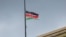 A Kenyan national flag flies at half mast in Nairobi on April 19, 2024, in honor of its defense chief General Francis Omondi Ogolla and nine other senior military officers who were killed in a helicopter crash.