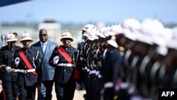 FILE - President of the Democratic Republic of the Congo Felix Tshisekedi inspects a guard of honor upon his arrival for a state visit to Botswana at the Sir Seretse Khama International Airport in Gaborone on May 9, 2023. 