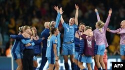 England's players react after winning the Australia and New Zealand 2023 Women's World Cup semi-final football match 