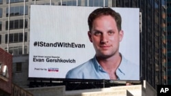 FILE - A billboard calling for release of Wall Street Journal reporter Evan Gershkovich is seen on the one-year anniversary of his imprisonment in Russia, in New York's Times Square, March. 29, 2024. 