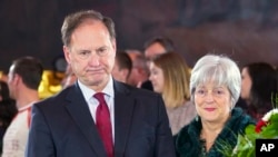 FILE - Supreme Court Justice Samuel Alito Jr., left, and his wife, Martha-Ann Alito, pay their respects at the casket of the Rev. Billy Graham at the Rotunda of the US Capitol Building in Washington, Feb. 28, 2018.