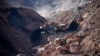 In this photo released by China's Xinhua News Agency, rescuers work at the site of a collapsed open pit coal mine in Alxa League in northern China's Inner Mongolia Autonomous Region, Feb. 23, 2023. 