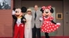 FILE - Mickey Mouse, Elizabeth Gluck, Richard M. Sherman and Minnie Mouse pose at the world premiere of Disney's 'Christopher Robin' at the Walt Disney Studios, July 30, 2018, in Burbank, Calif. 