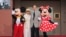 FILE - Mickey Mouse, Elizabeth Gluck, Richard M. Sherman and Minnie Mouse pose at the world premiere of Disney's 'Christopher Robin' at the Walt Disney Studios, July 30, 2018, in Burbank, Calif. 