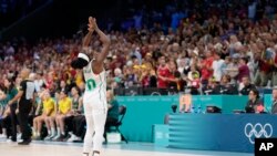 Promise Amukamara, of Nigeria, celebrates after Nigeria defeated Australia in a women's basketball game at the 2024 Summer Olympics, in Villeneuve-d'Ascq, France, July 29, 2024.