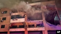 Smoke rises from a destroyed apartment as following a massive explosion in the southern suburb of Beirut, Lebanon on Tuesday, January 2, 2024.