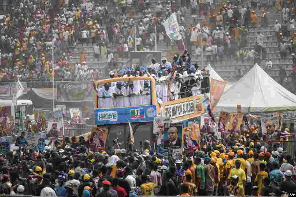 The bus of presidential candidate Bola Tinubu of the All Progressives Congress arrives at the Teslim Balogun Stadium during their final campaign rally in Lagos, Nigeria.