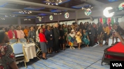 Participants pause for a group photo with U.S. Ambassador to Kenya Meg Whitman at the African Women Entrepreneurship Cooperative (AWEC) meeting in Nairobi. (Mariama Diallo/VOA)