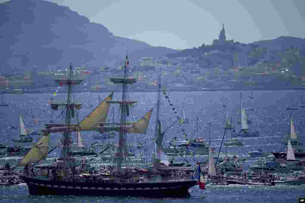 The Belem, the three-masted sailing ship which is carrying the Olympic flame, is accompanied by other boats approaching Marseille, southern France.