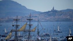 The Belem, the three-masted sailing ship which is carrying the Olympic flame, is accompanied by other boats approaching Marseille, southern France.