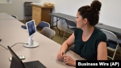 FILE - Advancements in telehealth, including this system by Compass Health Bridge, allow providers to see a client's environment using a mobile device.