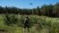 FILE: A Ukrainian Border Guard soldier catches a drone during a military exercise in central Ukraine, Tuesday, May 2, 2023.
