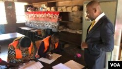 Citizens Coalition For Change Interim President Nelson Chamisa checking the voters role