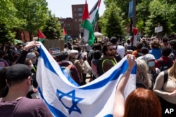 Israel supporters show up at George Washington University where students protest, during a pro-Palestinian protest against the Israel-Hamas war, April 26, 2024, in Washington.