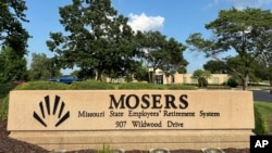 A sign for the Missouri State Employees' Retirement system is shown, with the office in the background, on July 23, 2024, in Jefferson City, Mo.