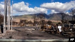 Debris of former shops and businesses on Front Street in burn zone 11A is pictured Dec. 8, 2023, in Lahaina, Hawaii. 