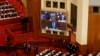 北京人大会堂的电子大屏幕显示李强在全国人大会议上讲话。（2023年3月5日）