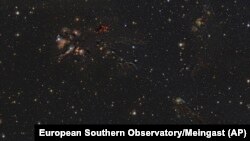 This image provided by European Southern Observatory shows the L1688 region in the Ophiuchus constellation. Astronomers published on May 11, 2023, a mosaic they created of stellar nurseries in our galactic backyard. (European Southern Observatory/Meingast via AP)