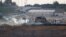 Israeli soldiers and Palestinian protesters clash near the border between Israel and the Gaza Strip as seen from the Israeli side, Sept. 23, 2023.