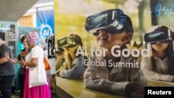 Visitors attend the AI for Good global conference on artificial intelligence, organized by the U.N.'s International Telecommunication Union (ITU), in Geneva, Switzerland, May 30, 2024.