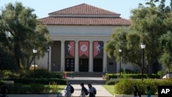 Students walk past the Thorne Hall at Occidental College campus in Los Angeles, July 27, 2023.