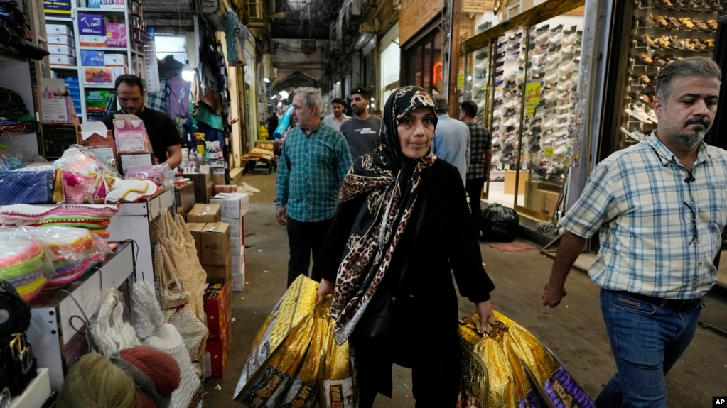 People shop at the old main bazaar of Tehran, Iran, April 24, 2024.