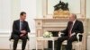 Russian President Vladimir Putin, right, listens to Syrian President Bashar al-Assad during their meeting at the Kremlin in Moscow, Russia, March 15, 2023.