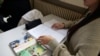 A textbook is seen on a high school student's desk during a philosophy class at the Averroes school, France's biggest Muslim educational institution that has lost its state funding, Lille, France, March 19, 2024.