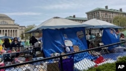 Pro-Palestinian protesters camp out in tents at Columbia University, April 27, 2024, in New York. Some Jewish students say campus protests against the war in Gaza have veered into antisemitism and made them afraid.