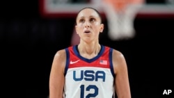 FILE - United States' Diana Taurasi looks on during the women's basketball preliminary round game against Japan at the 2020 Summer Olympics, July 30, 2021, in Saitama, Japan.