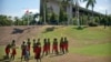 FILE - Performers in traditional clothing stand outside of Parliament Haus in Port Moresby, Papua New Guinea, on Nov. 16, 2018.