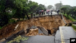FILE: A road connecting the two cities of Blantyre and Lilongwe is seen damaged following heavy rains caused by Tropical Cyclone Freddy in Blantyre, Malawi, March 14 2023.