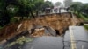 FILE - A road connecting the cities of Blantyre and Lilongwe is seen damaged following heavy rains caused by Tropical Cyclone Freddy in Blantyre, Malawi, March 14, 2023.