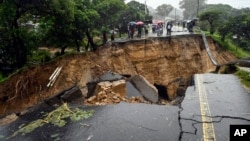 FILE - A road connecting the cities of Blantyre and Lilongwe is seen damaged following heavy rains caused by Tropical Cyclone Freddy in Blantyre, Malawi, March 14, 2023.