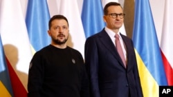 FILE - Poland's Prime Minister Mateusz Morawiecki, right, welcomes Ukrainian President Volodymyr Zelenskyy in Warsaw, April 5, 2023. Morawiecki said on Sept. 20, 2023, that his country was no longer sending new arms to Ukraine.