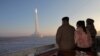 North Korean leader Kim Jong Un views the launch of a Hwasong-18 intercontinental ballistic missile during what North Korea says was a drill at an unknown location on Dec. 18, 2023, in this picture released by the Korean Central News Agency. (KCNA via Reuters)