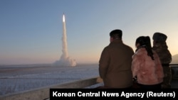 North Korean leader Kim Jong Un views the launch of a Hwasong-18 intercontinental ballistic missile during what North Korea says was a drill at an unknown location on Dec. 18, 2023, in this picture released by the Korean Central News Agency. (KCNA via Reuters)