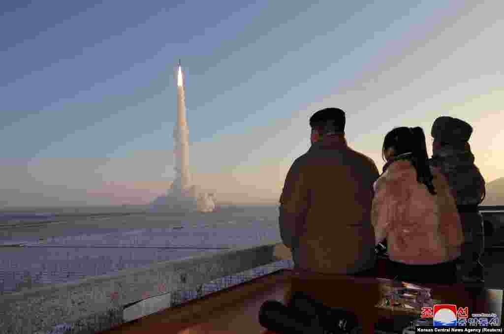 North Korean leader Kim Jong Un watches the launch of a Hwasong-18 intercontinental ballistic missile during what North Korea says is a drill at an unknown location, Dec.18, 2023.