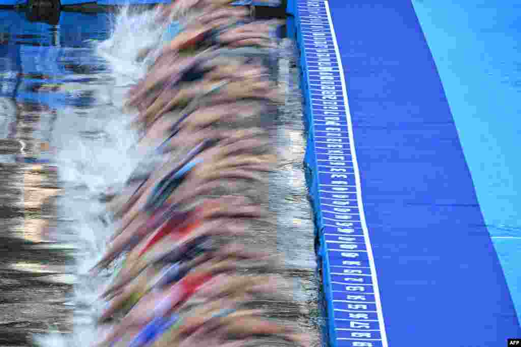 Triathlon athletes compete during a swimming event in the Seine River during a Test Event for the women&#39;s triathlon for the upcoming 2024 Olympic Games in Paris, France.