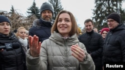 FILE - Moldovan President Maia Sandu attends a rally and concert, celebrating the European Union's decision to open membership talks with Moldova, in Chisinau, Dec. 17, 2023. 