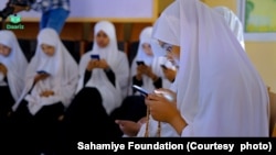 In this handout photo provided by the Sahamiye Foundation, high school girls are seen participating in the ''Daariz'' speed reading competition held in Hargeysa, Somaliland. 