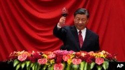 FILE - Chinese President Xi Jinping makes a toast after delivering a speech at the Great Hall of the People in Beijing on Sept. 28, 2023.