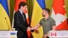 Ukrainian President Volodymyr Zelenskyy and Canadian Prime Minister Justin Trudeau shake hands during a press conference following their talks in Kyiv, June 10, 2023. 